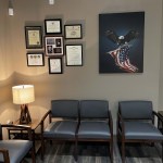 Seating and waiting area with art in the background