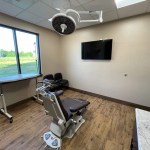 Behind view of treatment room with treatment chair